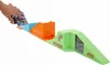 A child's hand is placing a toy skateboard onto a toy skatepark track. Produktbild-Vorschau