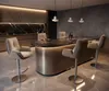 A modern kitchen or bar area with a large island, bar stools, and ambient lighting. Produktbild-Vorschau
