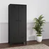 A black metal wardrobe with two drawers at the bottom, placed against a white paneled wall next to a potted plant. Voir les images du produit