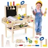 A young girl in overalls and a yellow hard hat stands next to a wooden toy workbench, holding tools. Náhled obrázku produktu