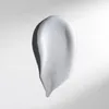 A swatch of white cream or serum is shown against a white background with soft shadows. Produktbild-Vorschau