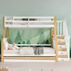A bunk bed with a trundle bed, set against a forest-themed wallpaper. Voir les images du produit
