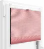 A close-up view of a pink pleated blind installed in a white window frame. Anteprima dell’immagine prodotto