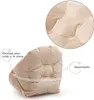A close-up view of a beige cushion with a white elastic strap, with a magnified inset showing the texture of the material. Produktbild-Vorschau