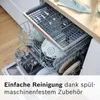 Inside of a dishwasher with racks filled with dishes and kitchen utensils. Produktbild-Vorschau