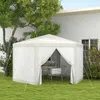 A white hexagonal gazebo with mosquito netting is set up in a grassy backyard next to a house and a tree. Produktbild-Vorschau