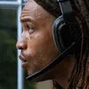 Close-up profile of a person wearing gaming headphones. Produktbild-Vorschau
