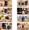 A collage of images showing a black electric kettle and its features, along with other kitchen appliances and food items on a countertop. Anteprima dell’immagine prodotto