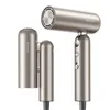 A studio shot of a gold-colored hair dryer against a white background. Produktbild-Vorschau