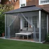 A screened gazebo with outdoor furniture on a wooden deck, adjacent to a house. Voir les images du produit