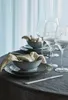 A table setting with bowls, plates, and wine glasses, suggesting a dining or entertaining context. Produktbild-Vorschau