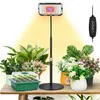 A grow light setup with plants on a table. Produktbild-Vorschau