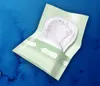 A package of TENA Lady Slim urological pads on a blue watercolor background. Podgląd zdjęcia produktu