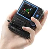A hand holding a black and blue digital component tester. Náhled obrázku produktu