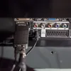 Close-up view of the back panel of a television or monitor, showing various input ports and connected cables. Náhled obrázku produktu