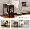 A collage of images showing a multifunctional side table in different settings, including next to a sofa, a bed, and a kitchen. Produktbild-Vorschau