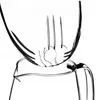 A close-up view of a glass teapot with a fork resting on its rim. Anteprima dell’immagine prodotto