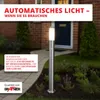 A stainless steel outdoor lamp with a motion sensor is shown in a garden setting, with a house entrance in the background. Produktbild-Vorschau
