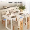 A dining table set up with place settings in a modern kitchen setting. Anteprima dell’immagine prodotto
