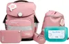 A collection of pink school supplies, including a backpack, pencil case, wallet, and lunchbox, arranged on a white background. Voir les images du produit
