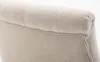 A close-up view of the textured fabric and stitching on the top edge of a chair or sofa. Produktbild-Vorschau