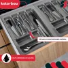 A close-up view of a cutlery organizer inside a kitchen drawer, showcasing its compartments and some utensils. Voir les images du produit