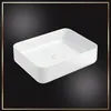 A white rectangular sink is shown against a black background with a gold border. Náhľad obrázku produktu