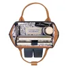 Top-down view of an open backpack with various items inside. Produktbild-Vorschau