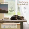 A cat sleeping on a standing desk in front of a window, with marketing overlays describing the desk's features. Produktbild-Vorschau