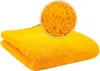 A folded yellow microfiber towel with a close-up inset showing the texture of the fabric. Produktbild-Vorschau