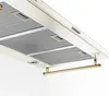 A close-up, low-angle view of a cream-colored kitchen range hood with gold accents, against a white background. Produktbild-Vorschau