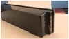 A black container with a white lid is placed on a light-colored surface. Produktbild-Vorschau