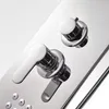 A close-up view of a chrome shower faucet panel with two handles and several small circular jets. Podgląd zdjęcia produktu