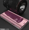 A rose gold flip case for a smartphone is shown in front of a camera lens. Produktbild-Vorschau