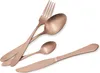 A set of rose gold cutlery, including a fork, a large spoon, a small spoon, and a knife, arranged on a white background. Podgląd zdjęcia produktu