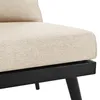 A close-up view of a beige upholstered furniture piece with a black frame and legs. Produktbild-Vorschau