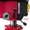 Close-up view of a red drill press with a depth gauge and adjustment mechanism. Produktbild-Vorschau