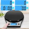A close-up shot of a digital kitchen scale with a finger pressing a button. The scale has a black weighing platform and a silver base with a blue digital display. Produktbild-Vorschau