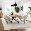 A dining room scene with a table and chairs, set up for a meal. Produktbild-Vorschau