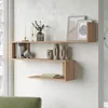 A modern wooden wall shelf unit displaying decorative items and books. Produktbild-Vorschau