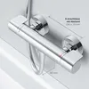 A chrome-finished shower thermostat mounted on a white tiled wall. Produktbild-Vorschau
