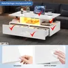 A modern white coffee table with storage drawers and integrated lighting. Produktbild-Vorschau