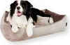 A border collie dog is lying on a brown corduroy dog bed. Produktbild-Vorschau
