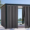 Outdoor curtains hanging on a modern structure with a pool and trees in the background. Produktbild-Vorschau
