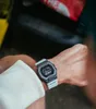 A person wearing a G-Shock watch on their wrist. Podgląd zdjęcia produktu
