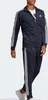 A man wearing a navy blue Adidas tracksuit with white stripes. Produktbild-Vorschau