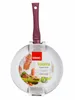 A frying pan with a red and white label attached. Anteprima dell’immagine prodotto