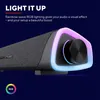 A close-up of a black soundbar with rainbow RGB lighting around the volume knob, set against a dark blue background. Voir les images du produit