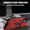 A red and black phone case with a ring holder is shown in a close-up shot, with a blurred background of a laptop and headphones. Produktbild-Vorschau