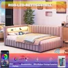 A pink upholstered L-shaped bed with built-in LED lighting and a headboard shelf. Náhled obrázku produktu